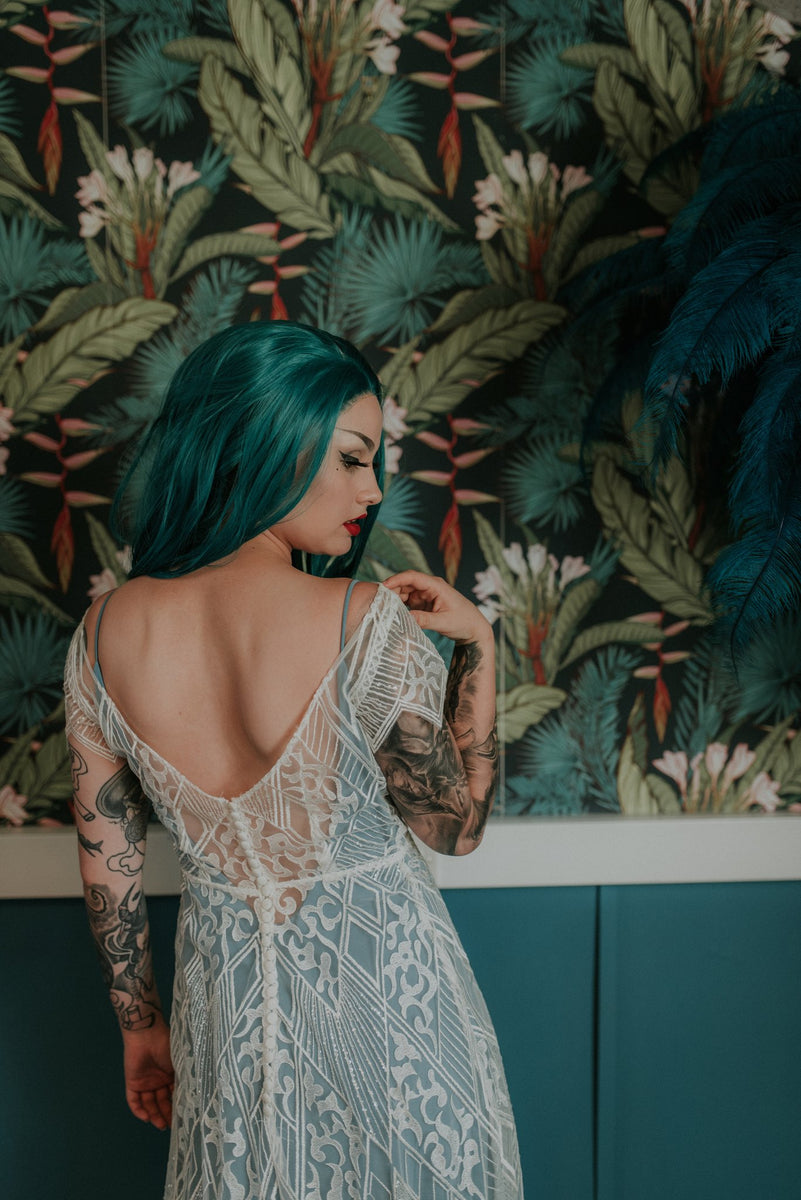 Bride showing off the perfect curved back to our Labyrinth lace wedding dress - Lookbook