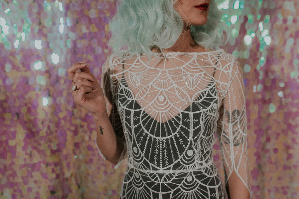Close-up of a Great Gatsby inspired wedding dress with black slip dress- Lookbook