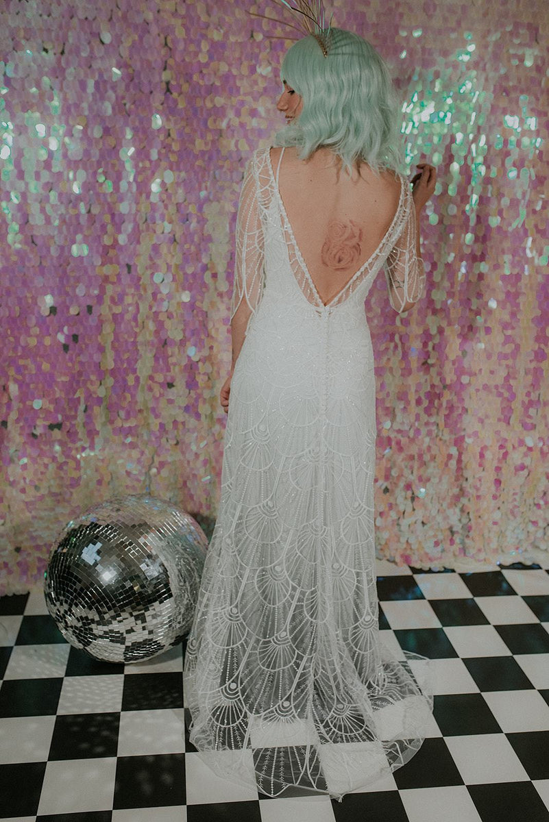 An elegant Bohemian wedding dress with a pink sequin back-drop - Lookbook