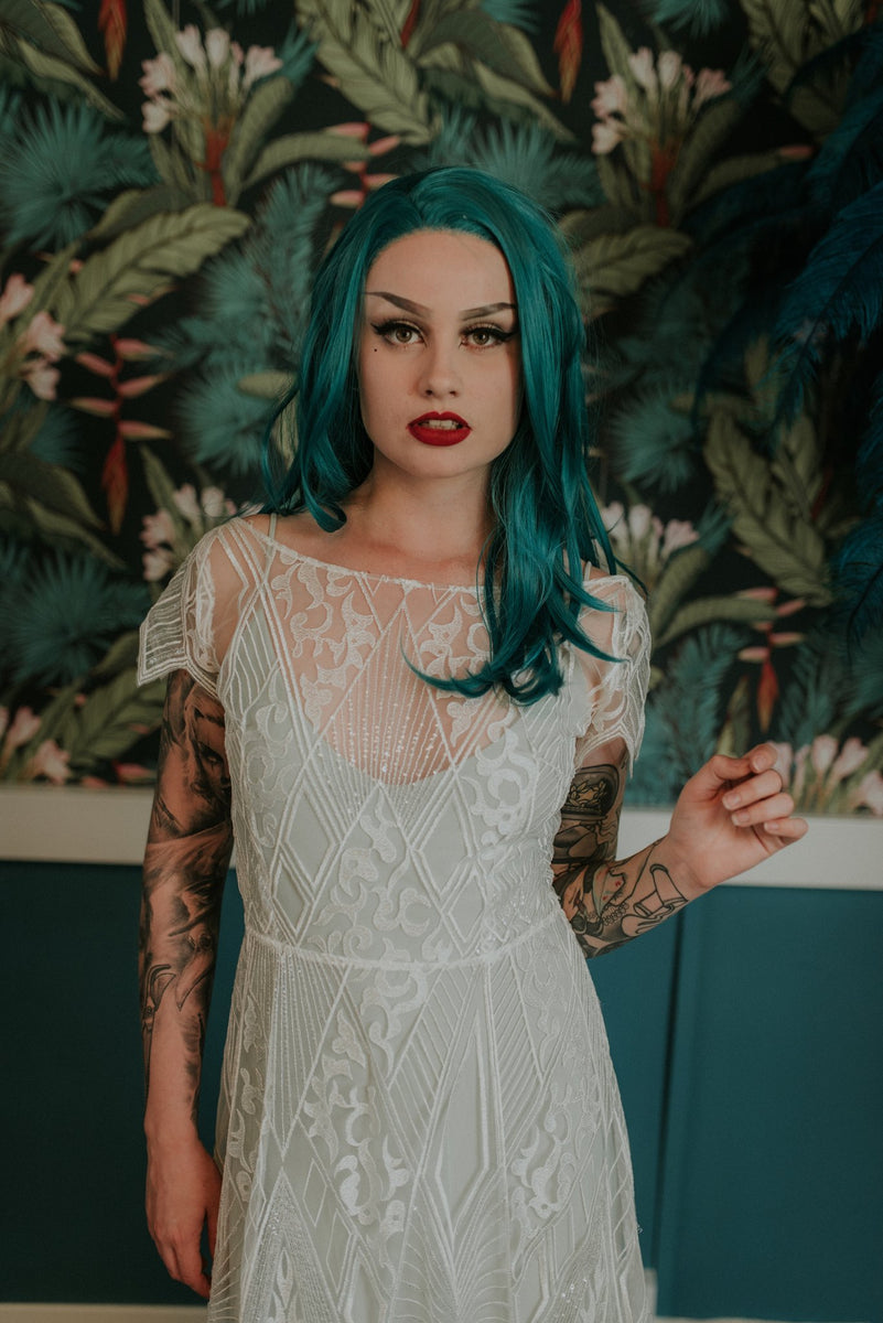 Elegant tattooed bride with light blue slip dress under our Labyrinth lace wedding dress - Lookbook